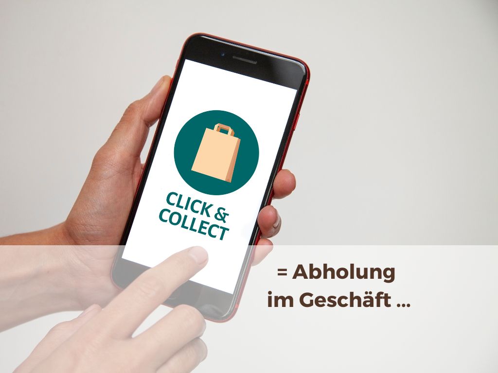 Abholung im Geschäft oder Click&&Collect bei Schuh Hölscher Hände zeigen Handy auf dem Symbol zu Click&Collect zu sehen ist