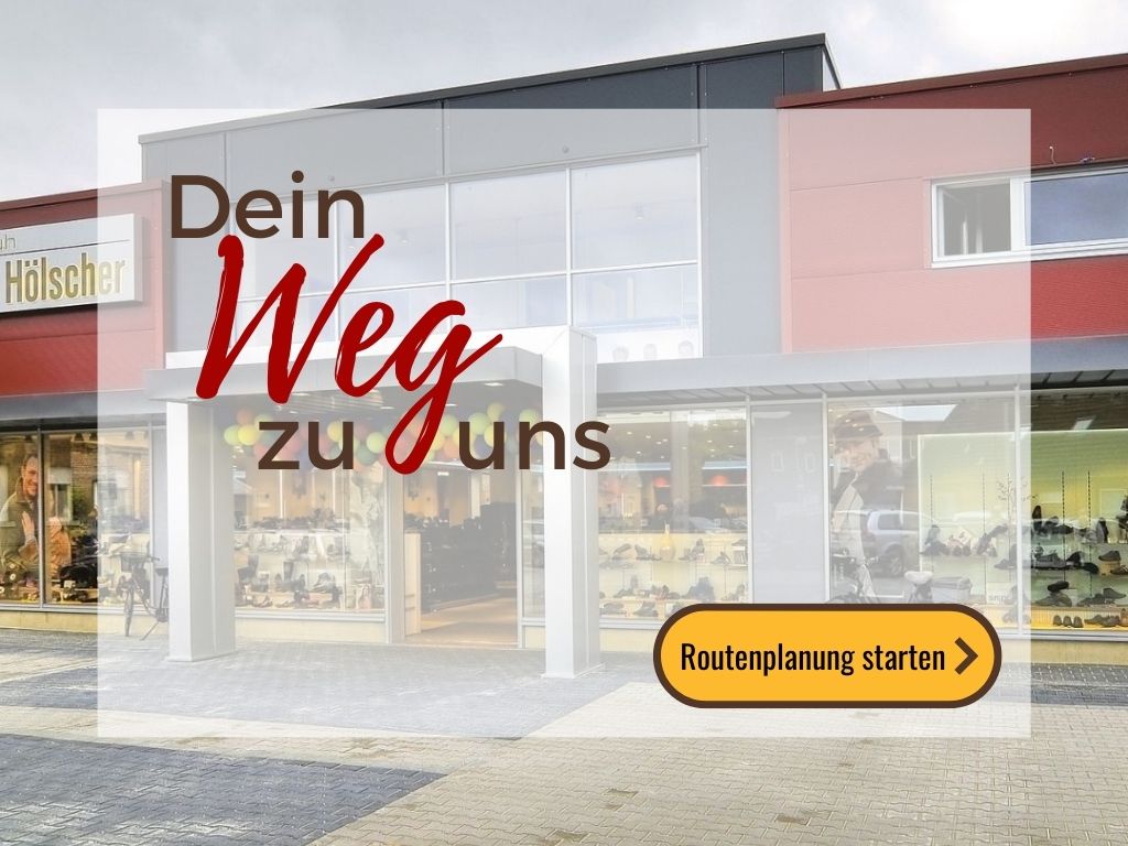 Ansicht Schuh Hölscher Gebäude im Hintergrund  vorne Button zur Routenplanung