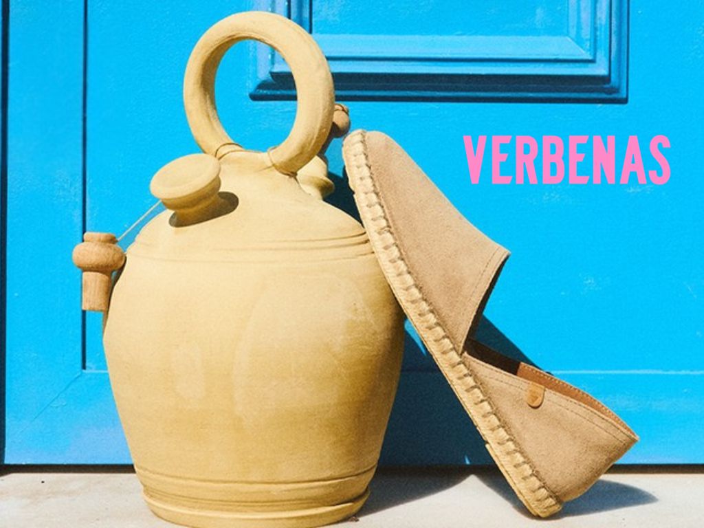 Verbena espadrill lehnt an tonkaraffe